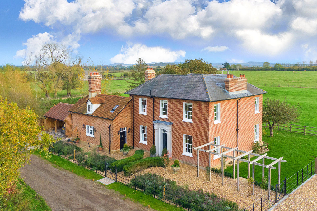 The front view of Alnwick farm house.|The outside view of Alnwick farm house.|Office and stairway in Alnwick farm house.|Pink and Blue rooms.|Split image of Alnwick Farm House.|Georgian farmhouse.|Real Homes - Alnwick Farm House.|Alnwick Farm House