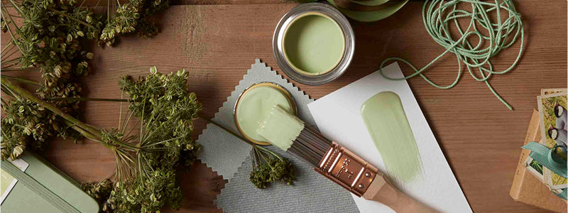 All about Earthborn header banner.|what makes us different|Sample pot lids with colour swatches.