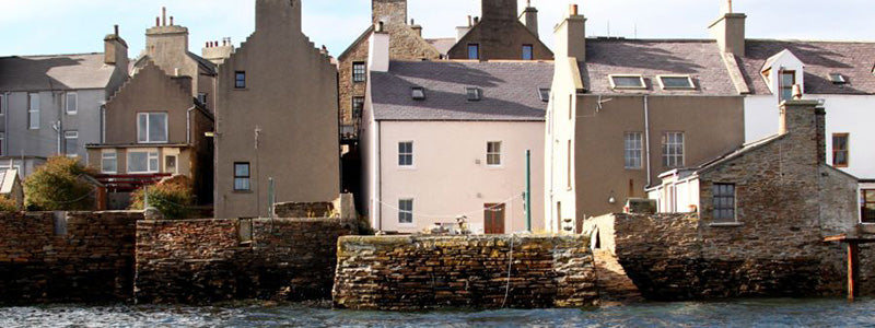 Street view of houses.|Choosing exterior paint.|Two photo's side by side of an older building and it's plaster work.|Exterior of a house with double bay windows and two small trees on either side of the front door.