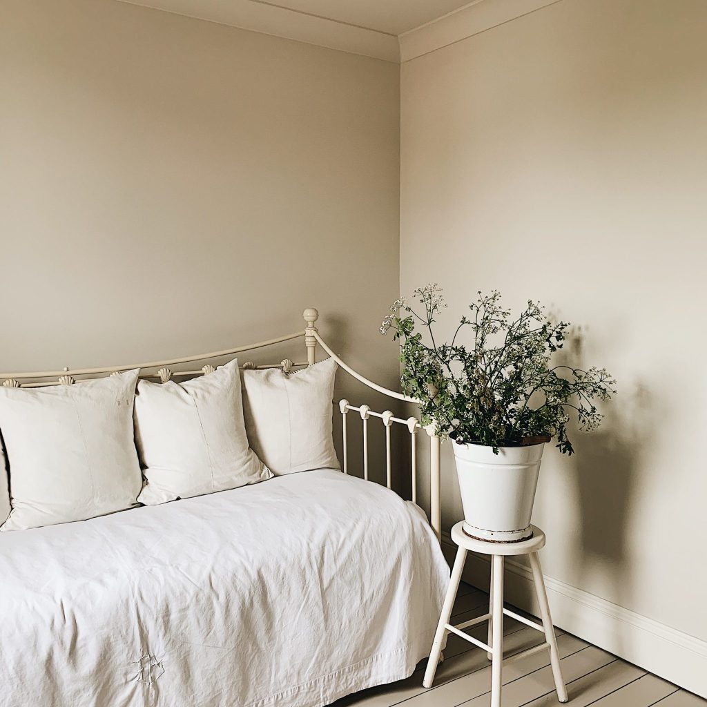 Bedroom - Tom's Bakery|Bucket of flowers.|Tom's Bakery bedroom painted in Claypaint.|Neutral bedroom - Tom's Bakery|Tom's Bakery bedroom