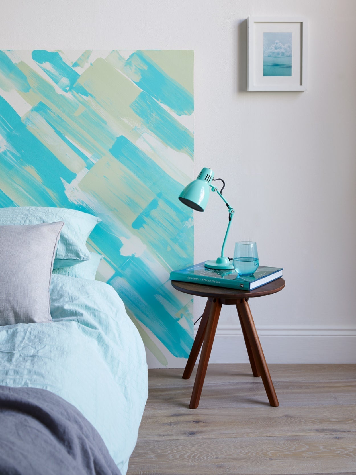 Coastal interiors bedroom design idea, a painted headboard|Coastal Charm flat lay.
