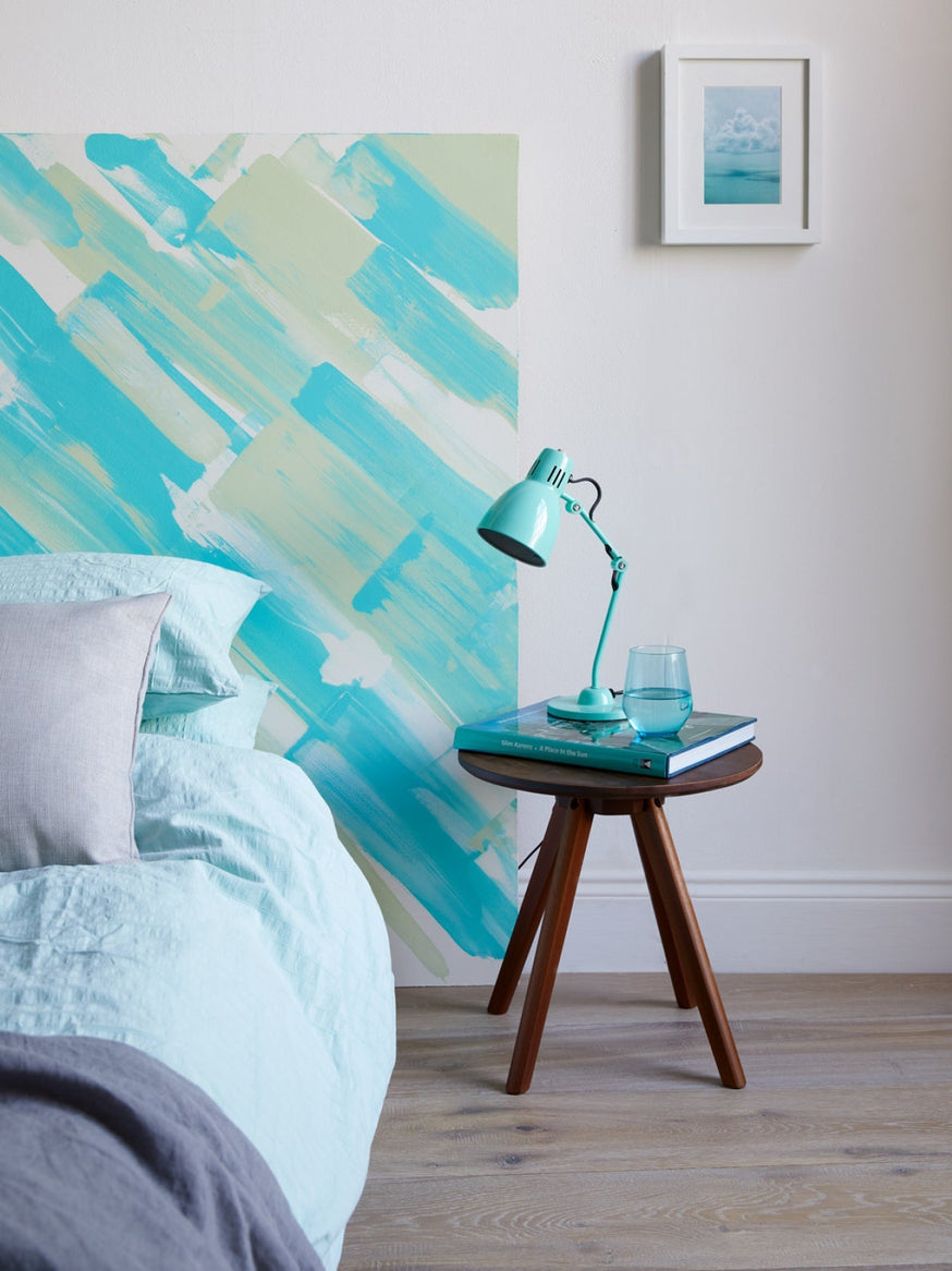 Coastal interiors bedroom design idea, a painted headboard|Coastal Charm flat lay.