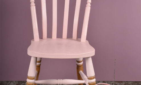 Chair painted in Rosie Posie with props.