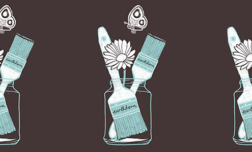 A jar of paint brushes with butterflies and flowers illustration.