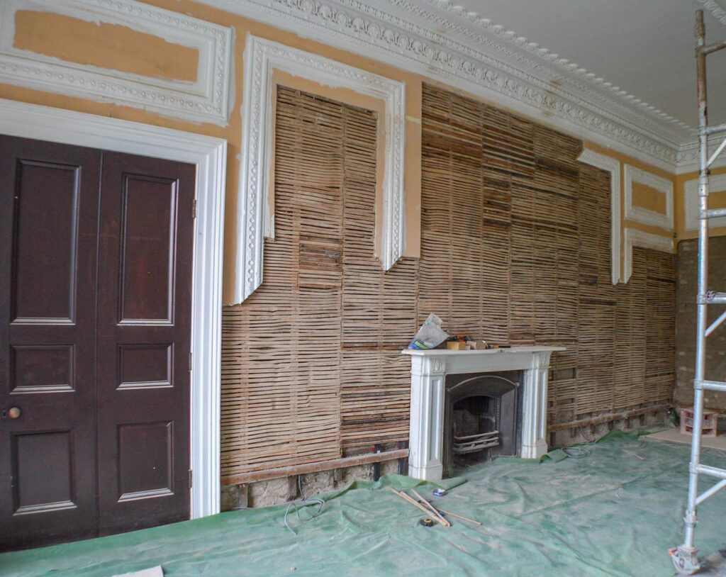 The Club Room at Moreton house was stripped back before lime plastering and painting in Earthborn