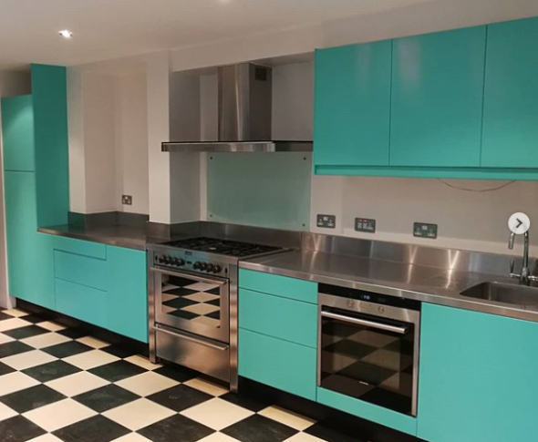 A painted kitchen in Earthborn's Eggshell No.17 using bright turquoise The Lido