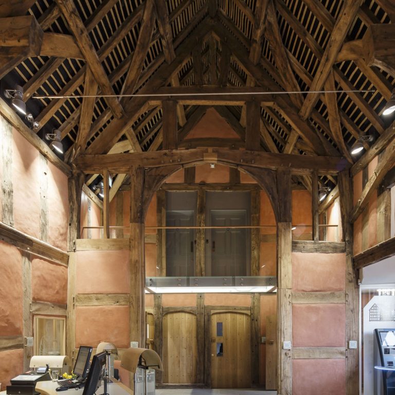 Inside an older property with wooden beams.