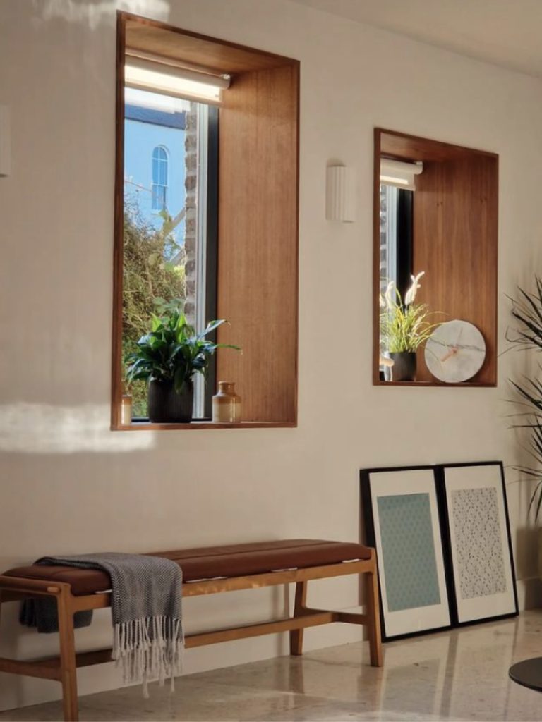 Inside Bray Coach House looking out through windows and a wooden bench.