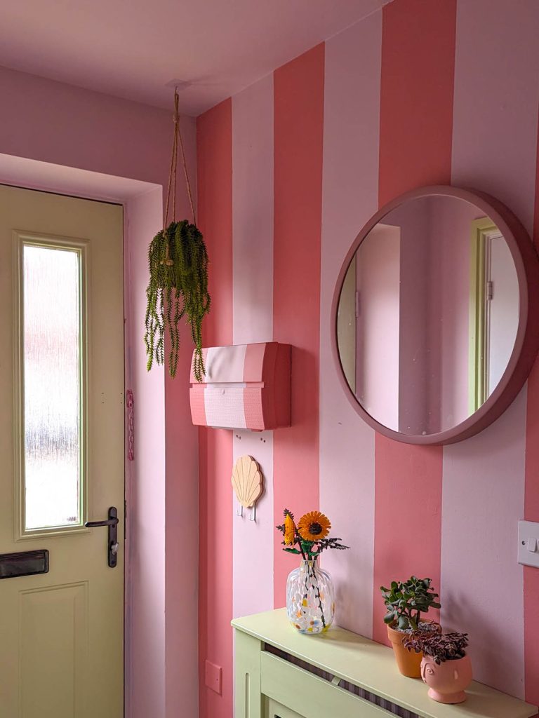 A stripped hallway painted in a easy clean emulsion in the shades Delilah and Rosie Posie.