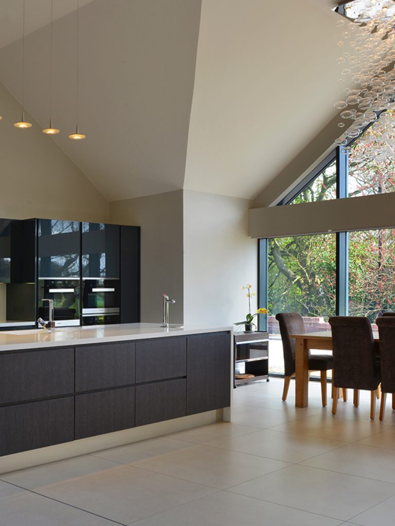 Open plan kitchen and dinning room painted in Tom's Bakery.