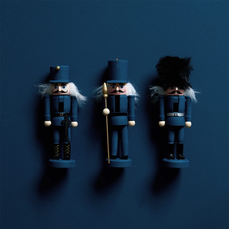 Toy Soldier with little wooden toy soldiers toys - flat lay.