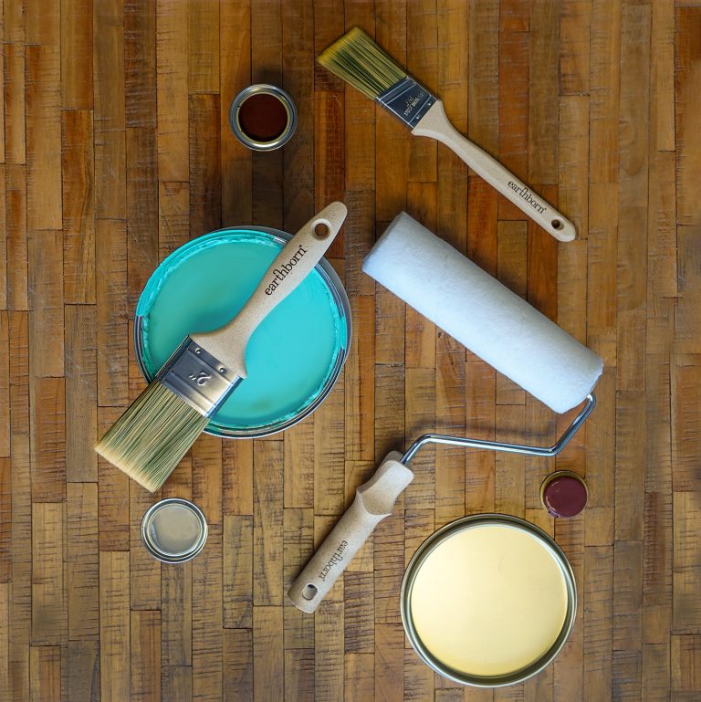 All Earthborn Tools with paint tins on a wood backdrop.