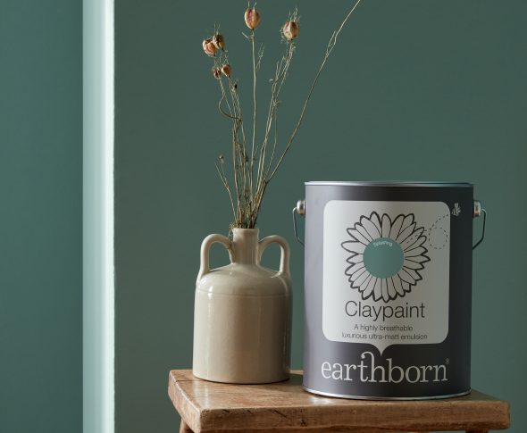 Splashing wall with paint tin.