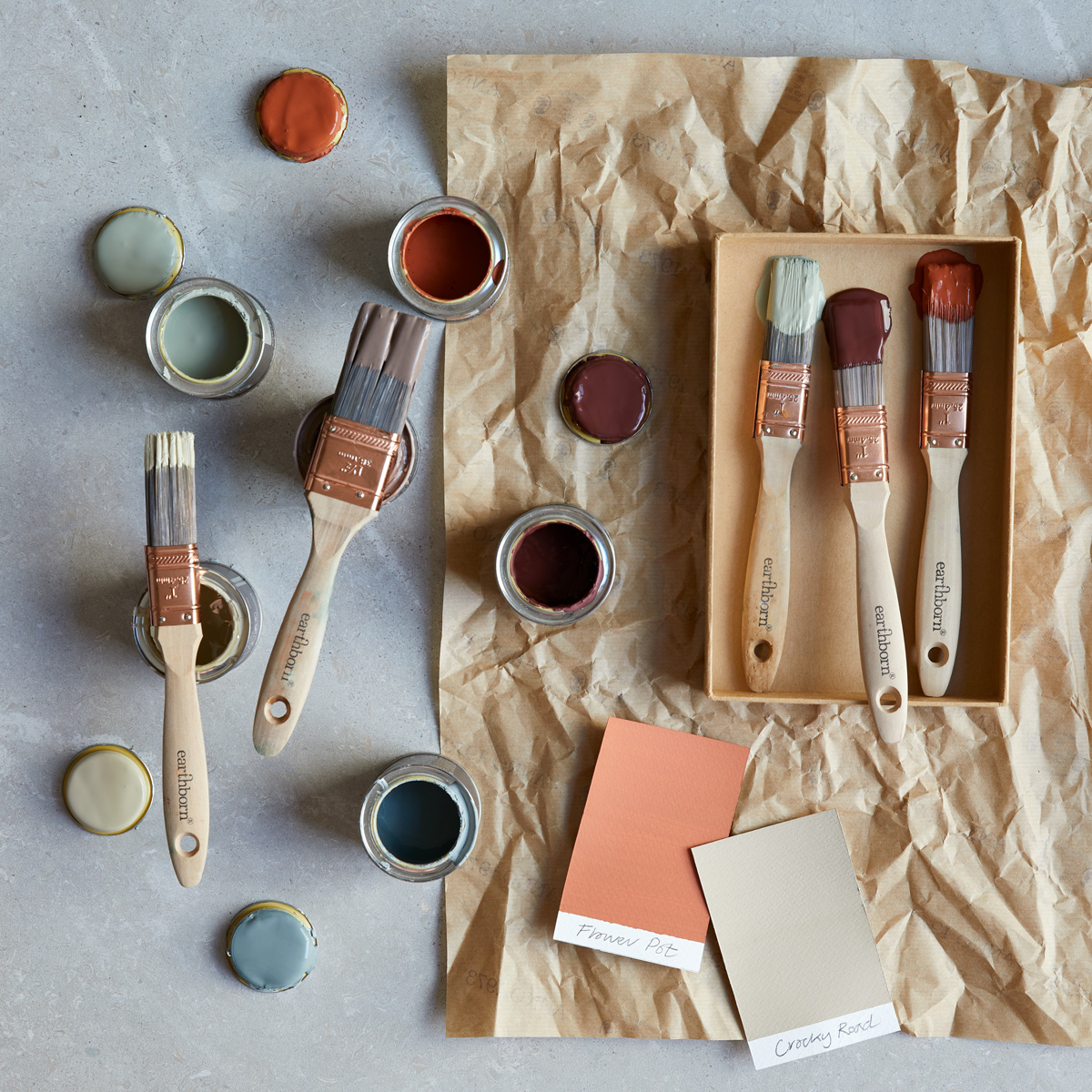 Colour pots and paint brushes