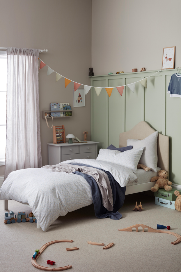 Kids bedroom with green painted panelling